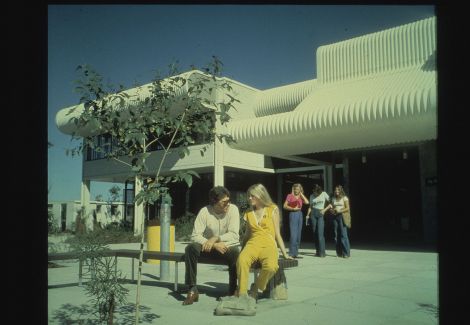 old building with students in front