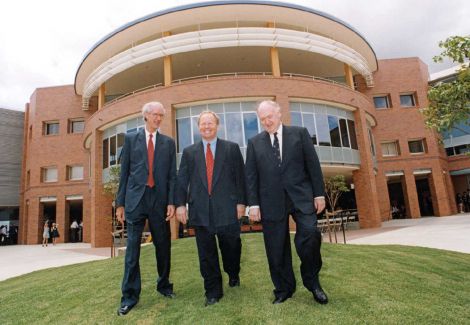 men walking in front of building