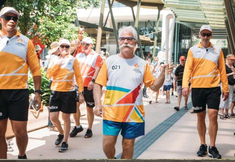 man running with baton