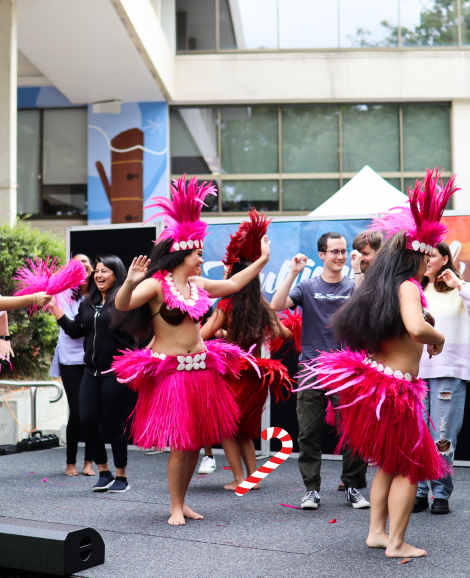 Performers and students dancing on stage