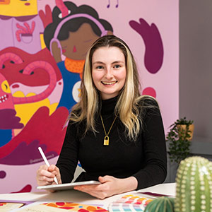 female student sitting in a creative art studio