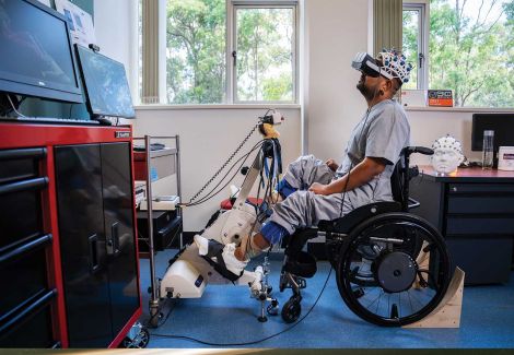 man in wheelchair doing research