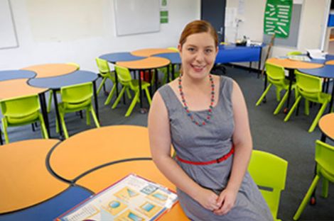 A woman sitting in a classroom