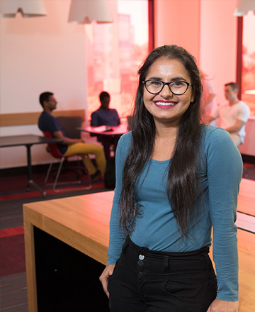 female student leaning on a table