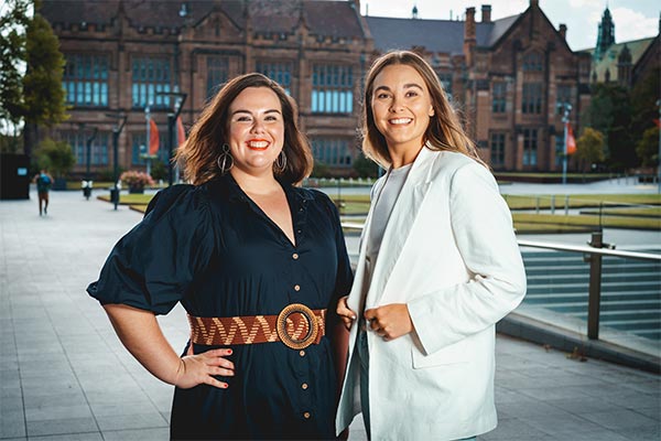 Two LeukBook cofounders standing in front of a historical building