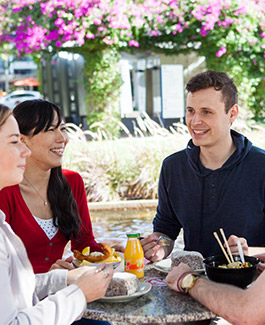 students sitting outside eating