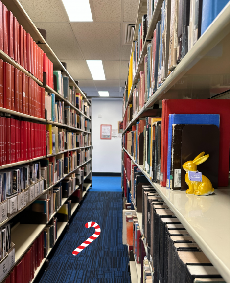 Library aisle with golden bunny hidden in the shelves